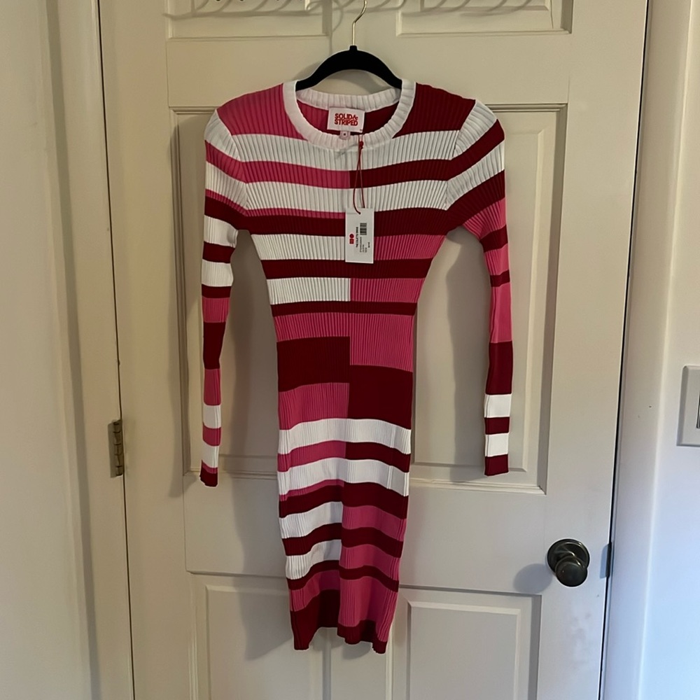 Stylish pink dress. New with tags medium. Stretchy material- nylon viscose